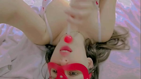 Sucking lollipop lay down on the bed and masturbation 