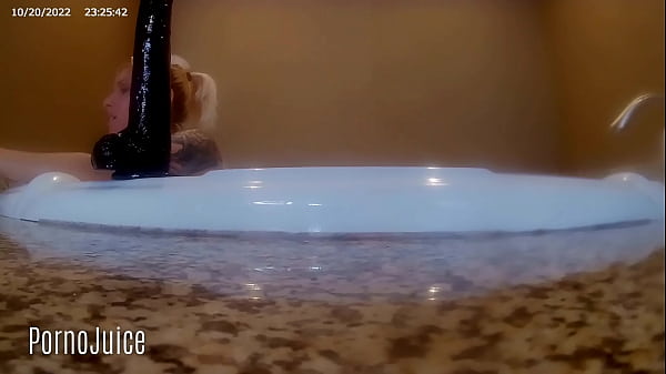 Petite blonde plays with huge bbc toy in the bath 