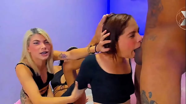 Blonde and brunette sluts show their best talent by sucking this big black cock 