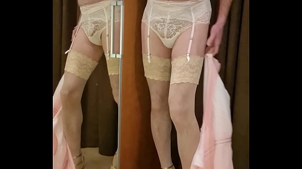 Crossdresserwearingluxurious lingerie in her boudoir