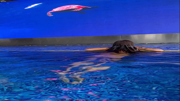 Monika fox in purple bikini swims in pool & poses by window against background of city free 