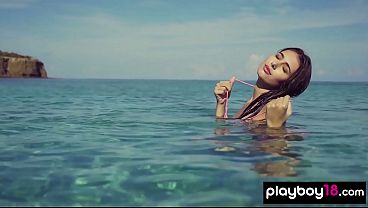 Petite small titted hottie posing nude in the ocean 