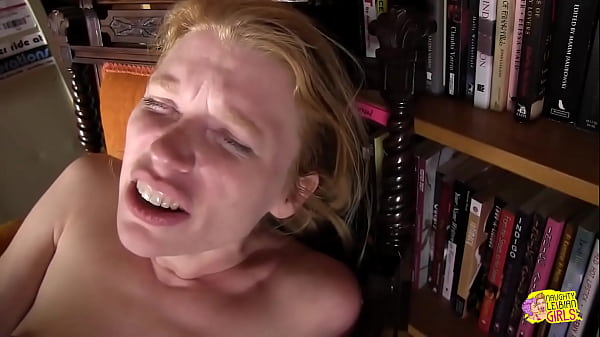 A very appealing individual with fair hair engages in oral genital stimulation with a companion while simultaneously inserting a large phallic object into her own body 