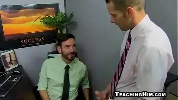 Horny mature hunk sucking a cock at the office 