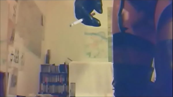 Madame Crudelitas masturbating in boots and stockings on table 