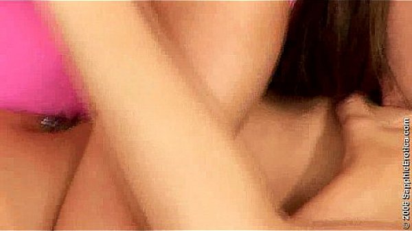 Two beautiful girls kissing in lesbian sex scene from Sapphic Erotica 