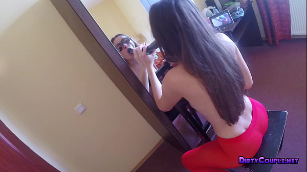Skinny brunette watching herself in the mirror sucking_dildo