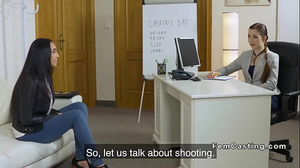 Tanned brunette model licks female agent 