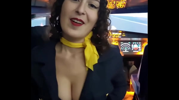 The flight attendant puts a dildo in her pussy on board