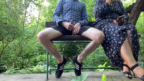 Dirty MILF jerks off my dick and shoots it on her phone in the park on a bench 
