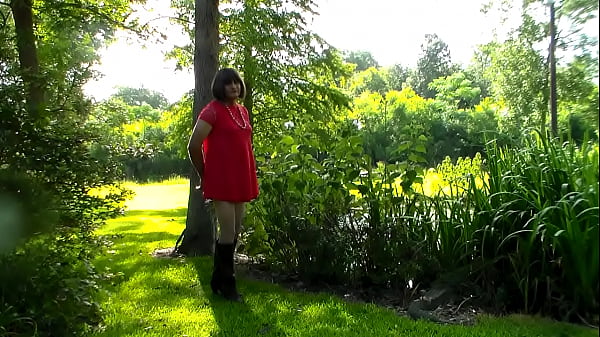 Crossdresser outdoors in a mini dress 