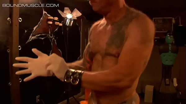 Play MP4 - Muscular guys tie each other up with ropes and chains