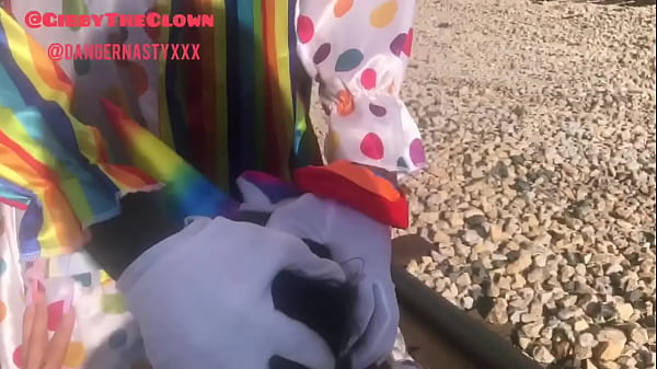 Play MP4 - Clown almost gets hit by train while getting head